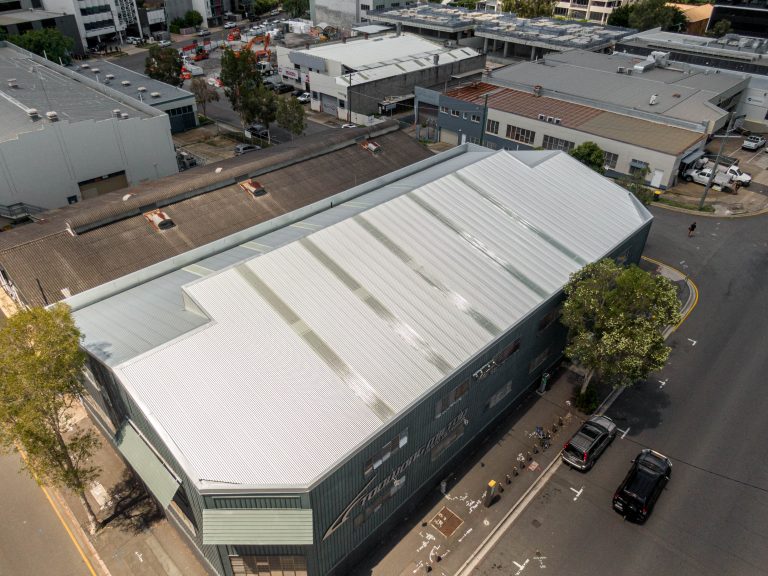 A commercial building with a new metal roof