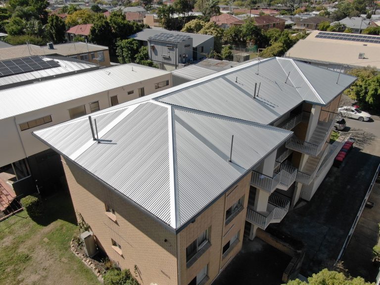 A residential block with new metal roofing