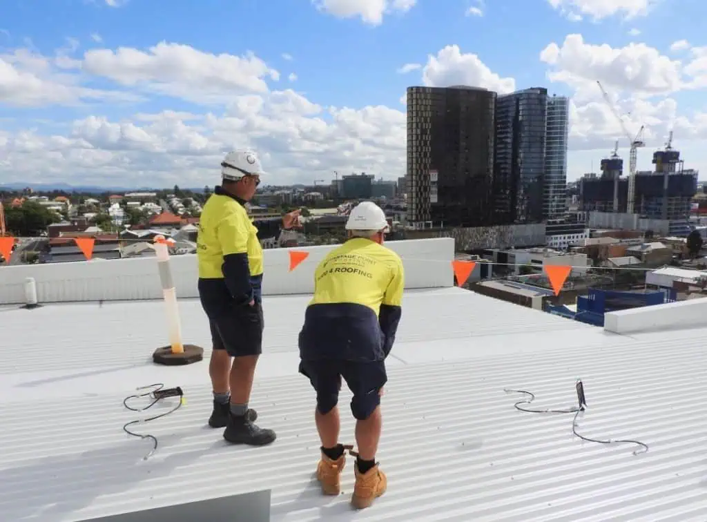 Roofers doing maintenance on a commercial roof