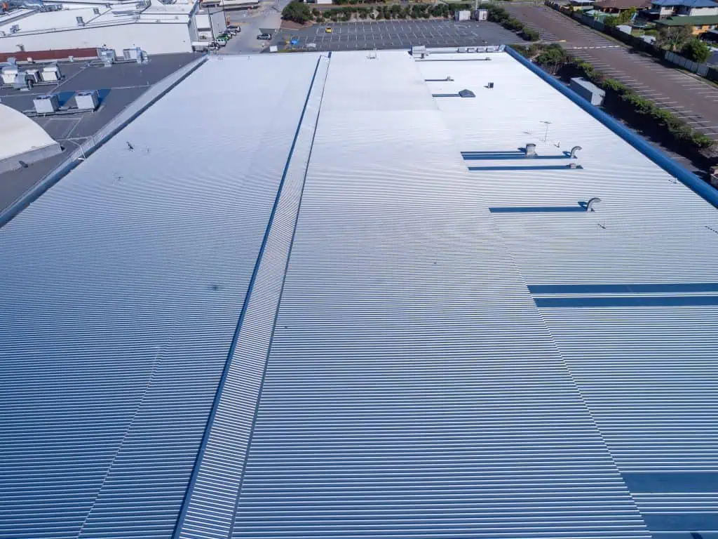 A finished metal roof replacement on a K-Mart Roof