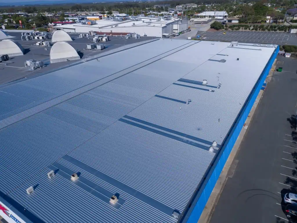 A finished metal roof replacement on a K-Mart Roof