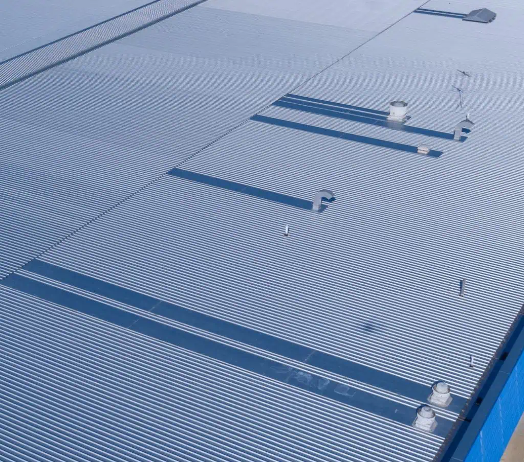 A finished metal roof replacement on a K-Mart Roof