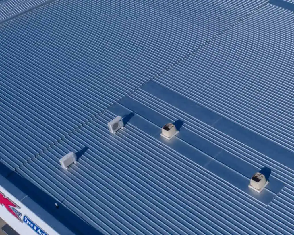 A finished metal roof replacement on a K-Mart Roof