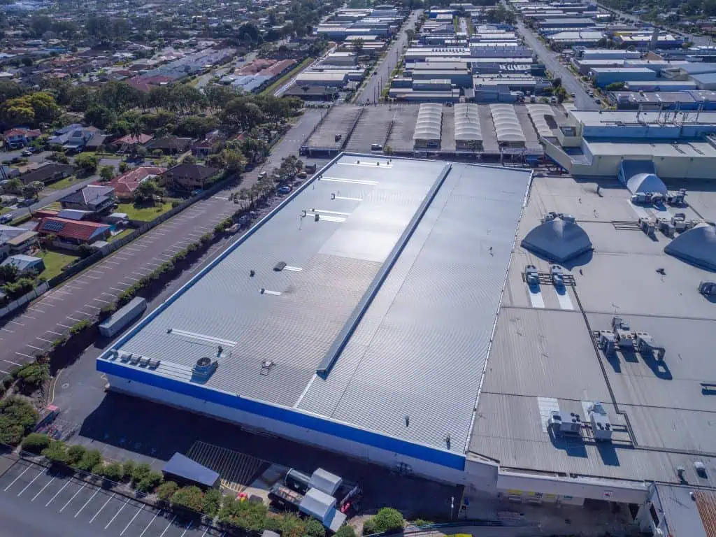 A finished metal roof replacement on a K-Mart Roof