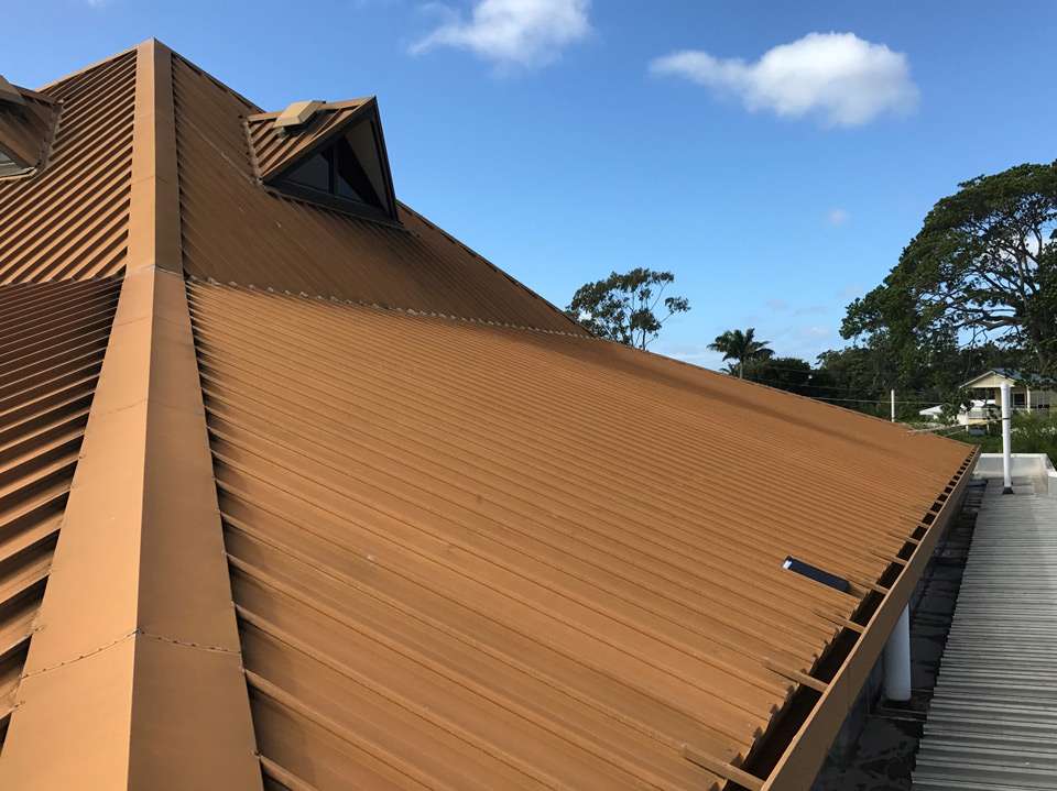 metal roof on a commercial building in Cleveland before replacement