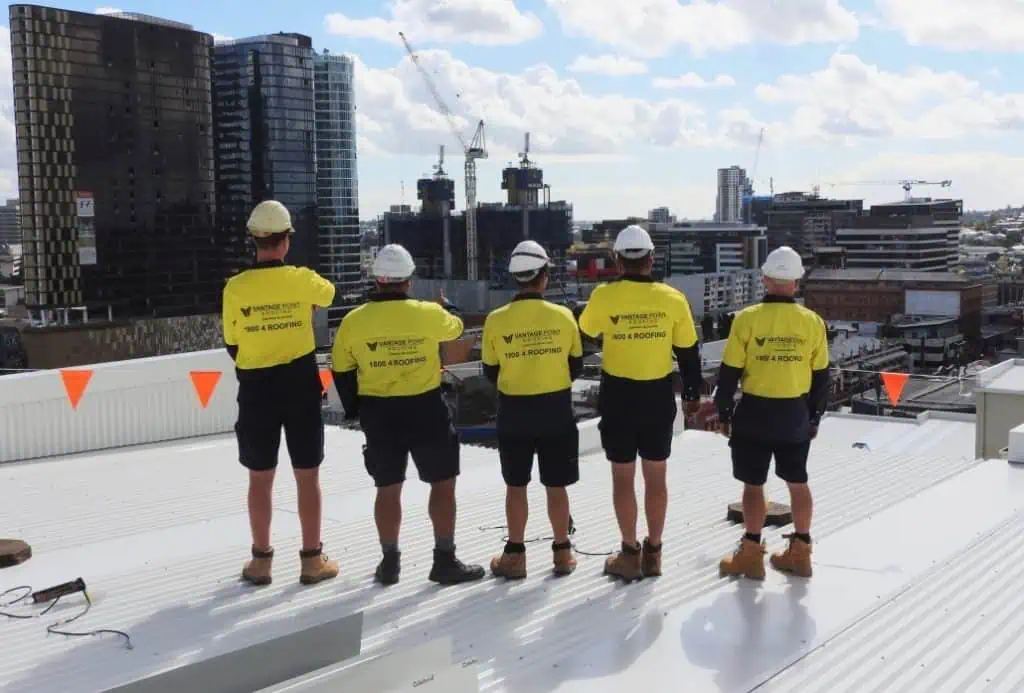 Vantage Point Roofing team standing on a commercial roof