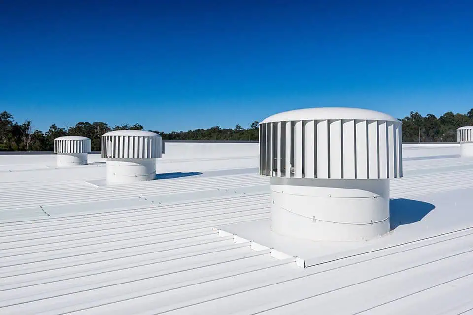 A metal commercial roof with hurricane vent