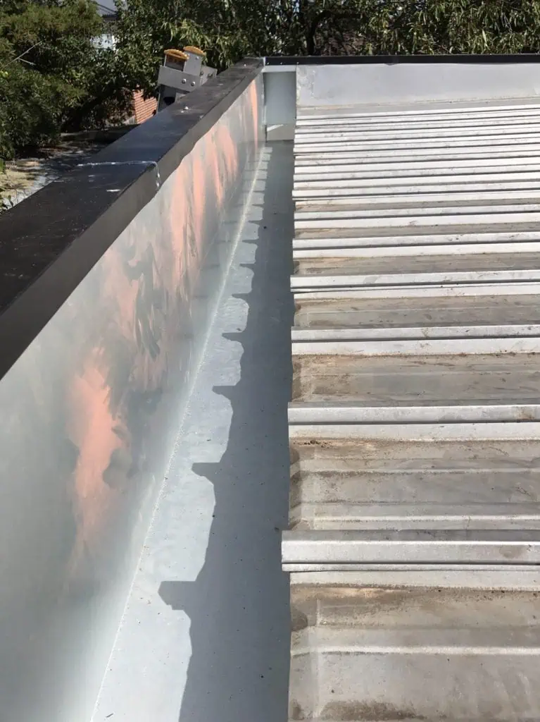 Guttering on a commercial metal roof